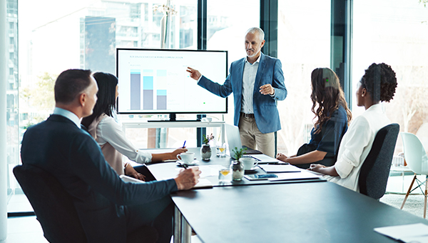 Business people viewing presentation in a conference room