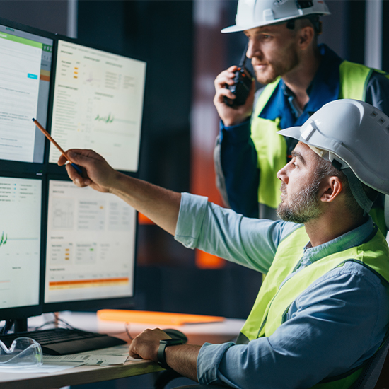 Engineers monitoring energy on the computer screens