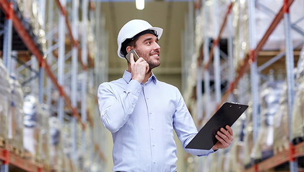 Employee in warehouse on tablet 