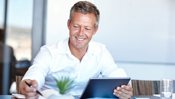 Businessman reviewing analytics data on a tablet