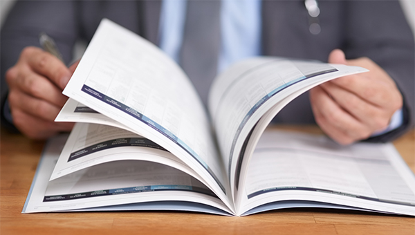 Business person flipping through document