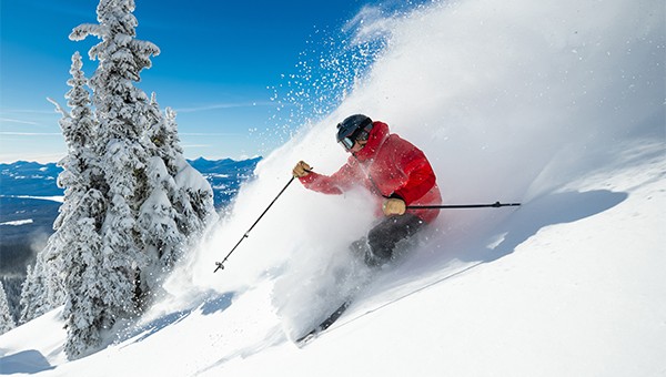 Skier going down a mountain