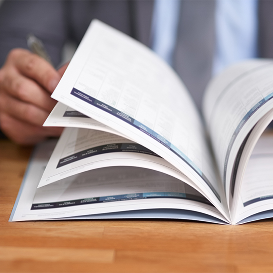 Business person flipping through document Business person flipping through document