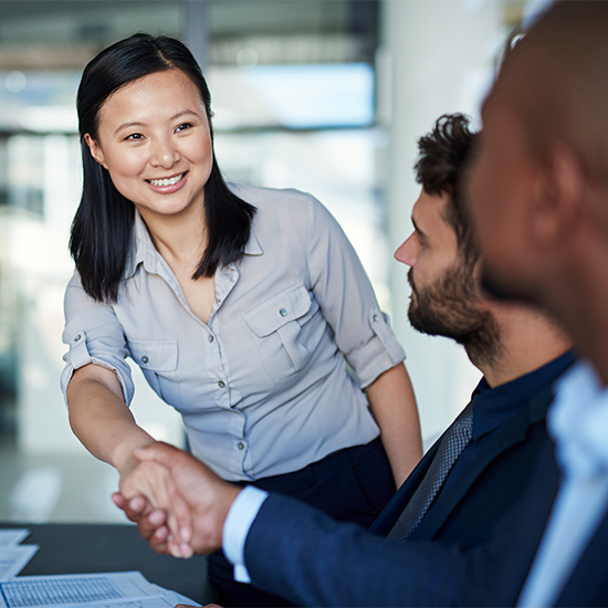 Business people in a meeting shaking hands Business people in a meeting shaking hands