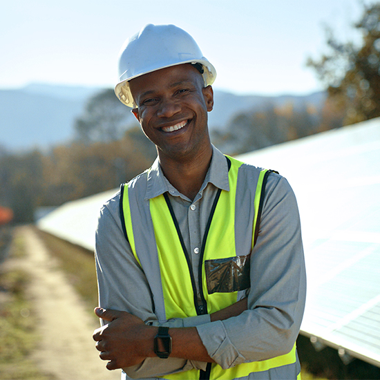 Utility worker with solar panels Utility worker with solar panels